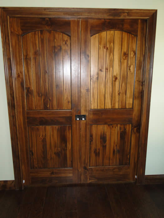 <p>Stained wood double doors</p>