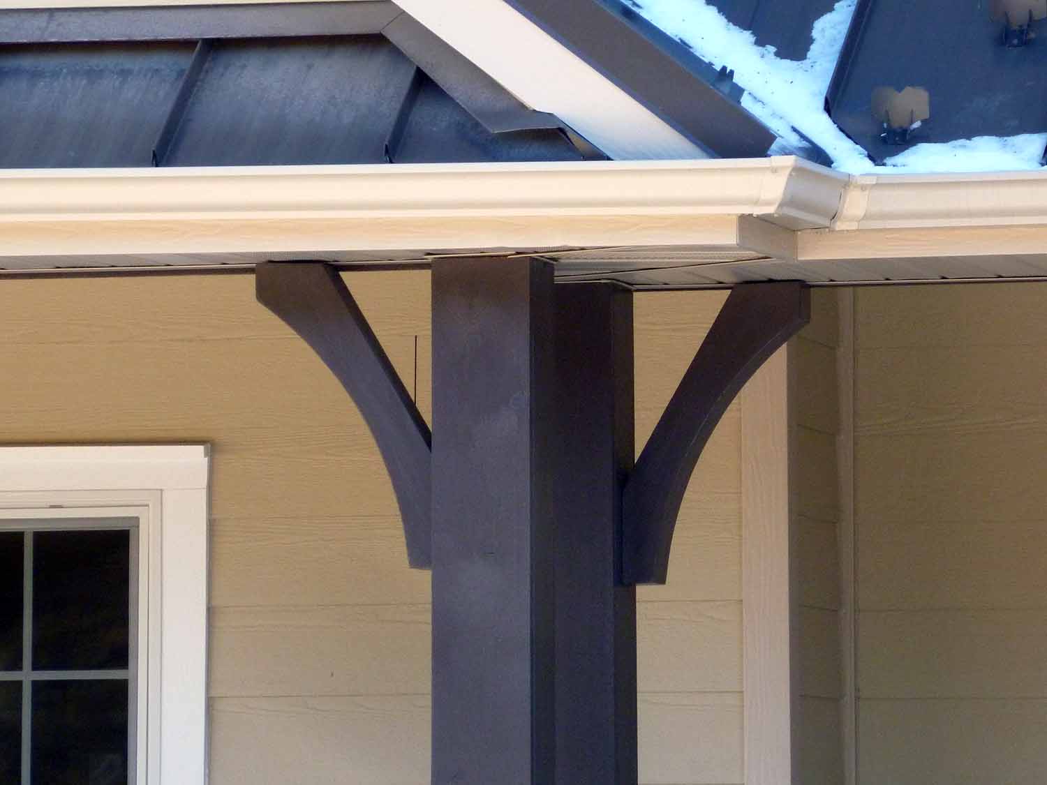 Porch post bracket made of painted wood
