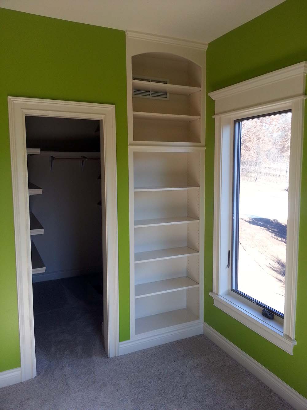 <p>Built in bookshelves in corner niche</p>