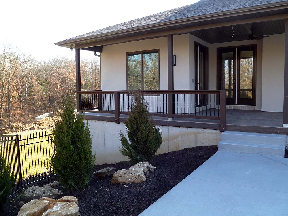 <p>Covered rear porch with stamped concrete floor</p>