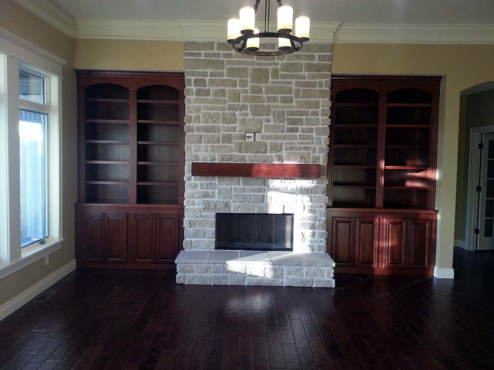 <p>Dark stained fireplace flanker</p>