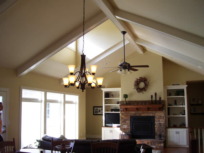 <p>Boxed painted wood beams on vaulted ceiling</p>