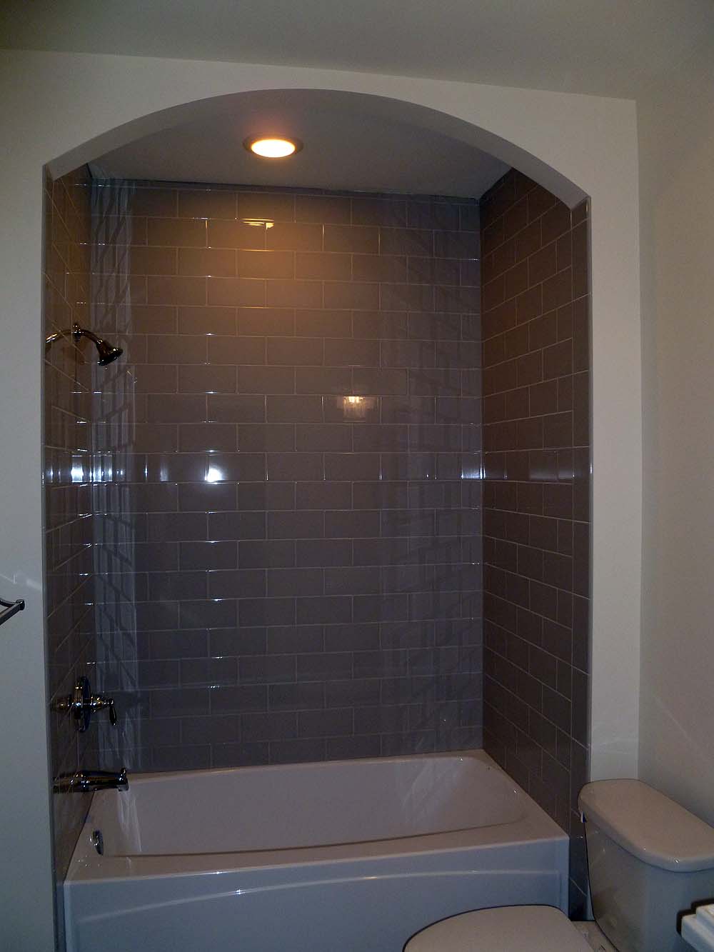 Shower with drywalled arch in front