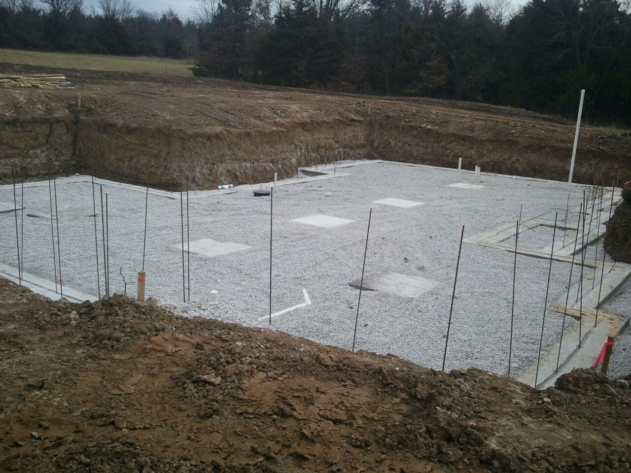 Concrete footings ready for basement wall forms.