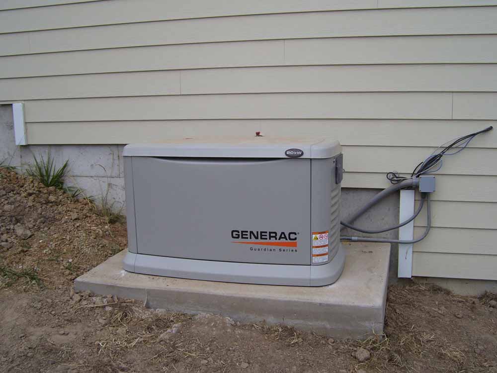 <p>Propand powered auxilary power generator at side of house</p>