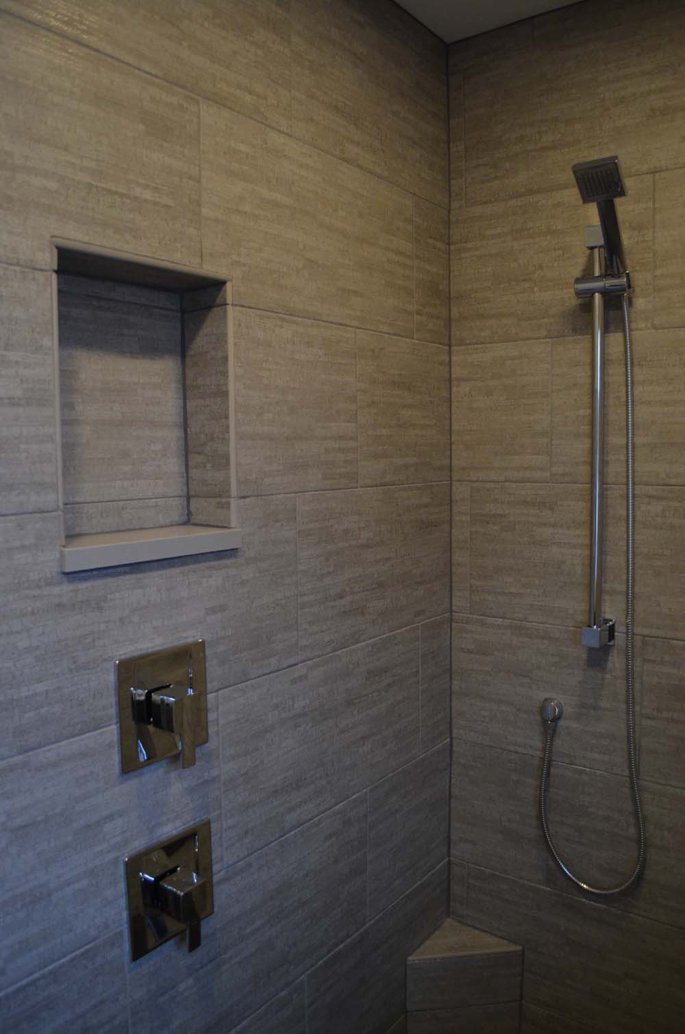 Shower with tile walls and niche