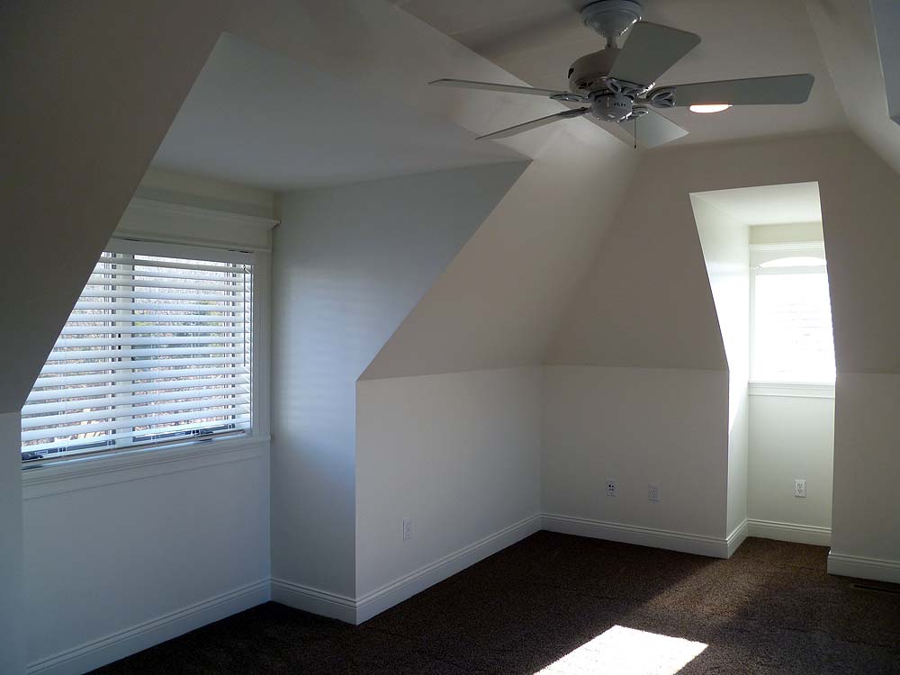<p>Sloping ceiling and dormers in bonus room over garage</p>