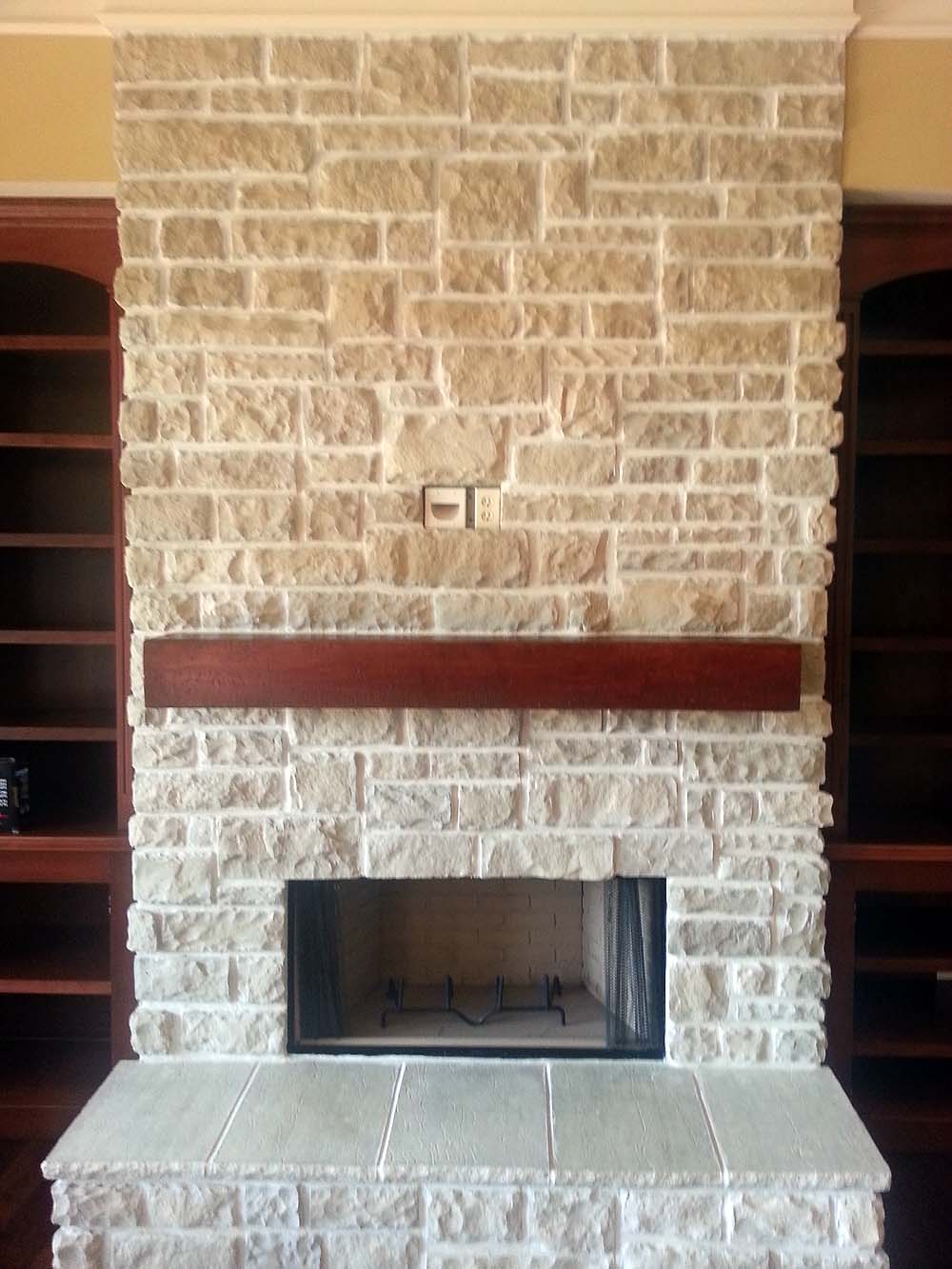<p>Stone fireplace front with boxed mantle</p>