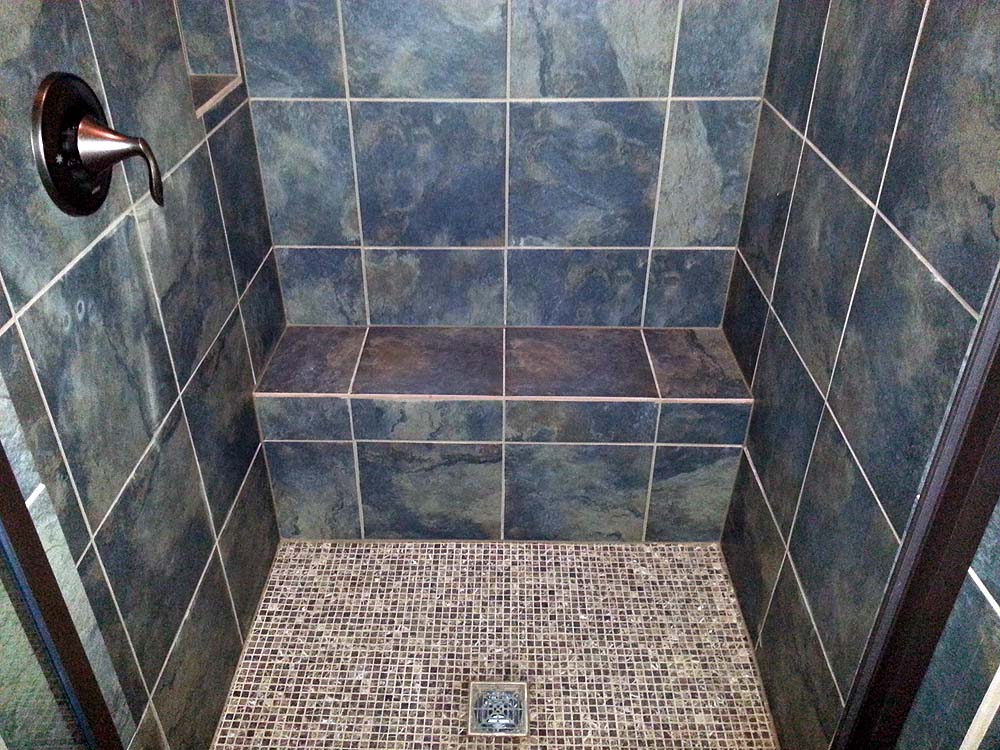 Tile shower with seat.