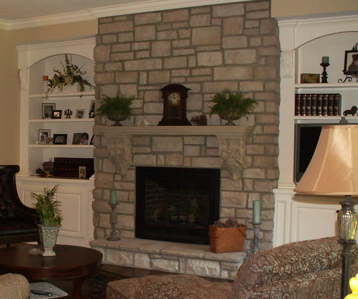 <p>Stone fireplace with cast mantle</p>