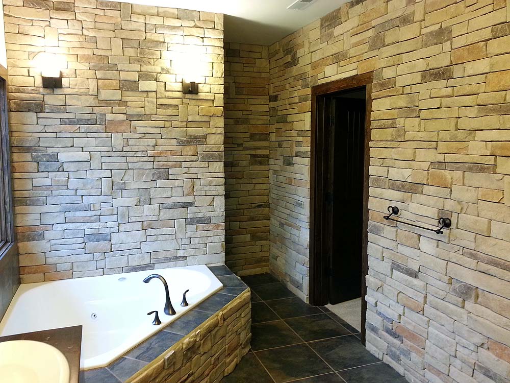 Corner tub with stone walls