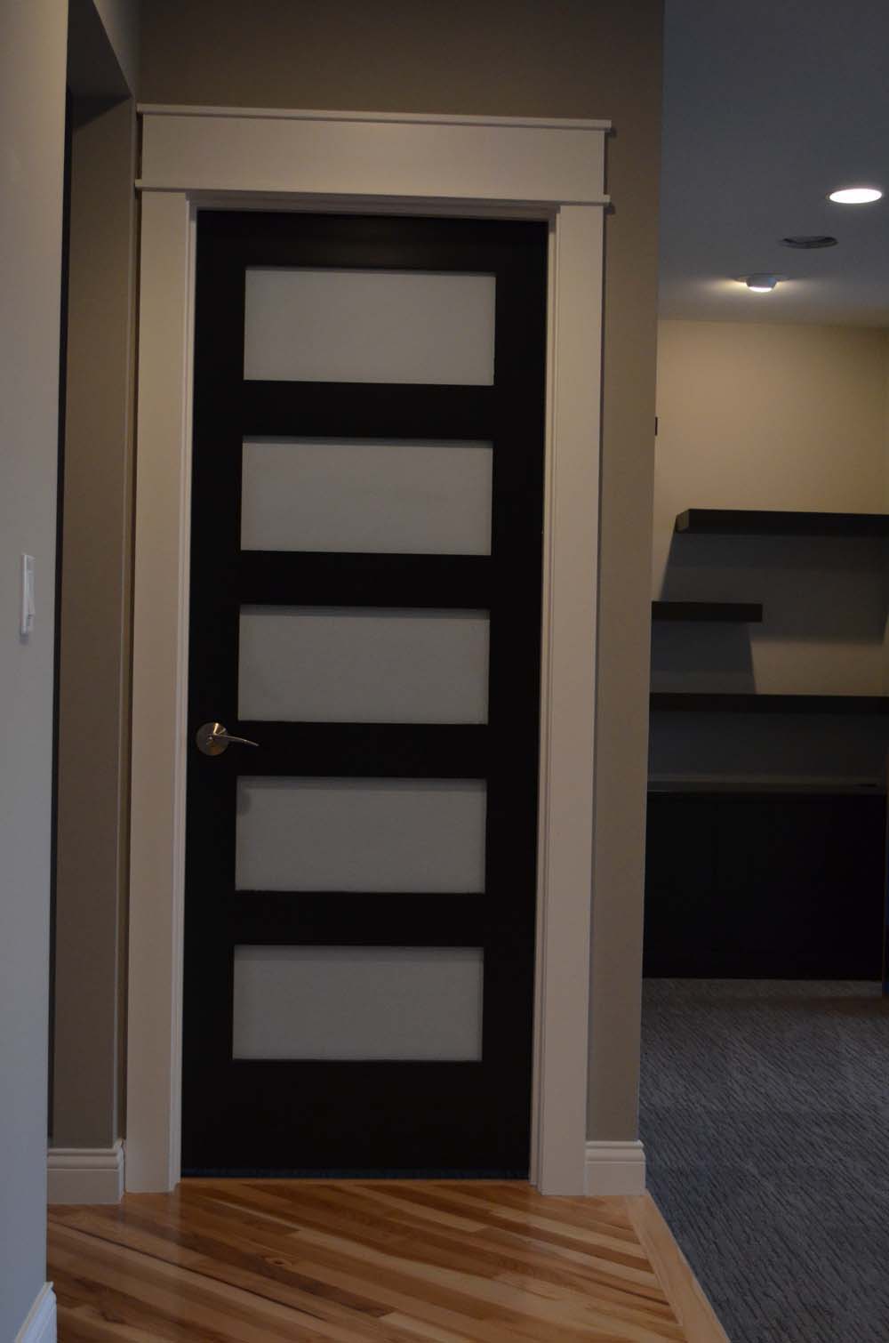 <p>Stacked panel door with glass inserts.</p>