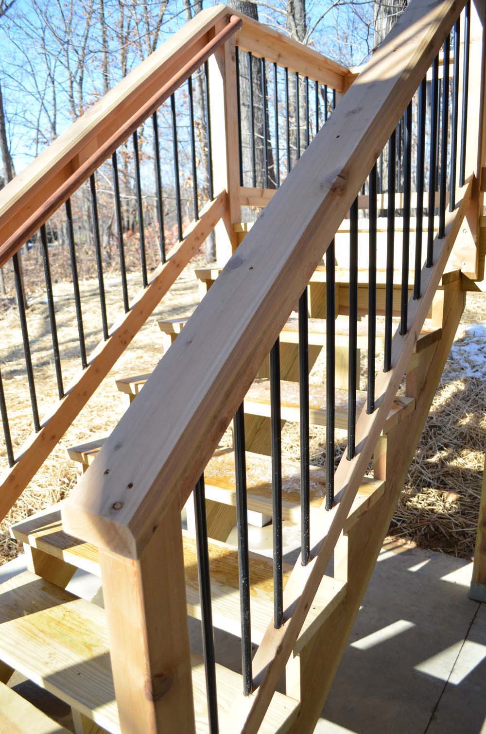 Deck stairs with Cedar top and bottom rail, aluminum spindles