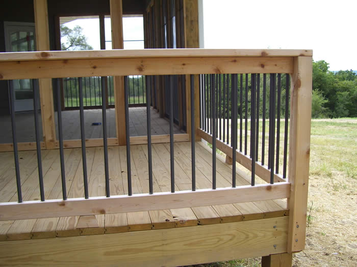 Cedar deck rail with aluminum spindles