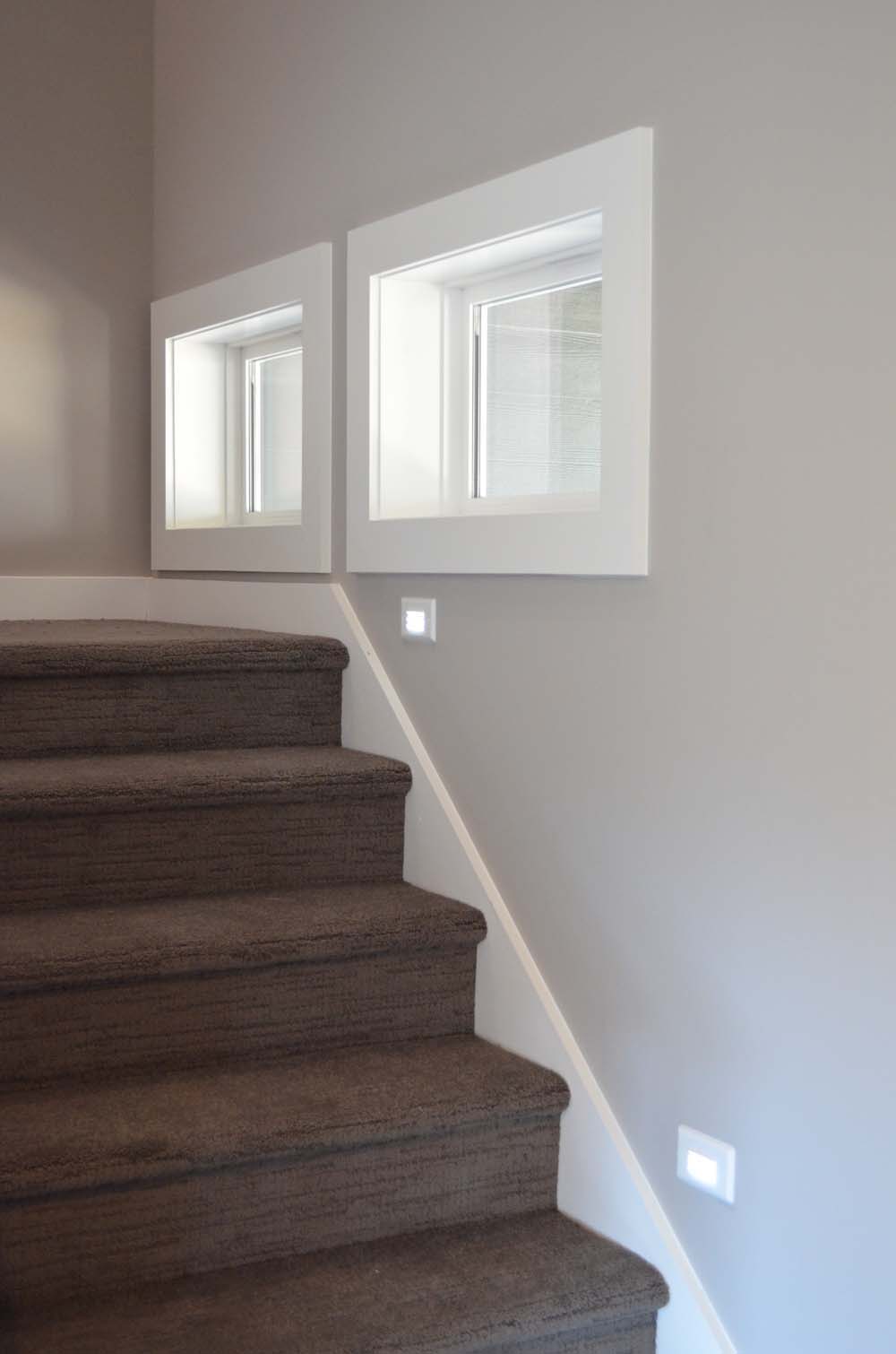 small windows on landing of stairs.